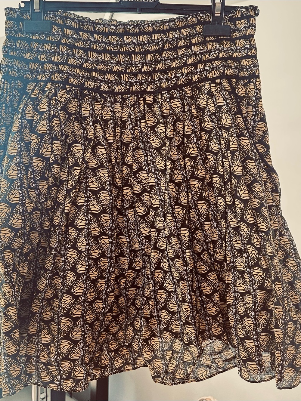 Smocked Waist Black and yellow Butterfly-Print flared Skirt with side pockets.